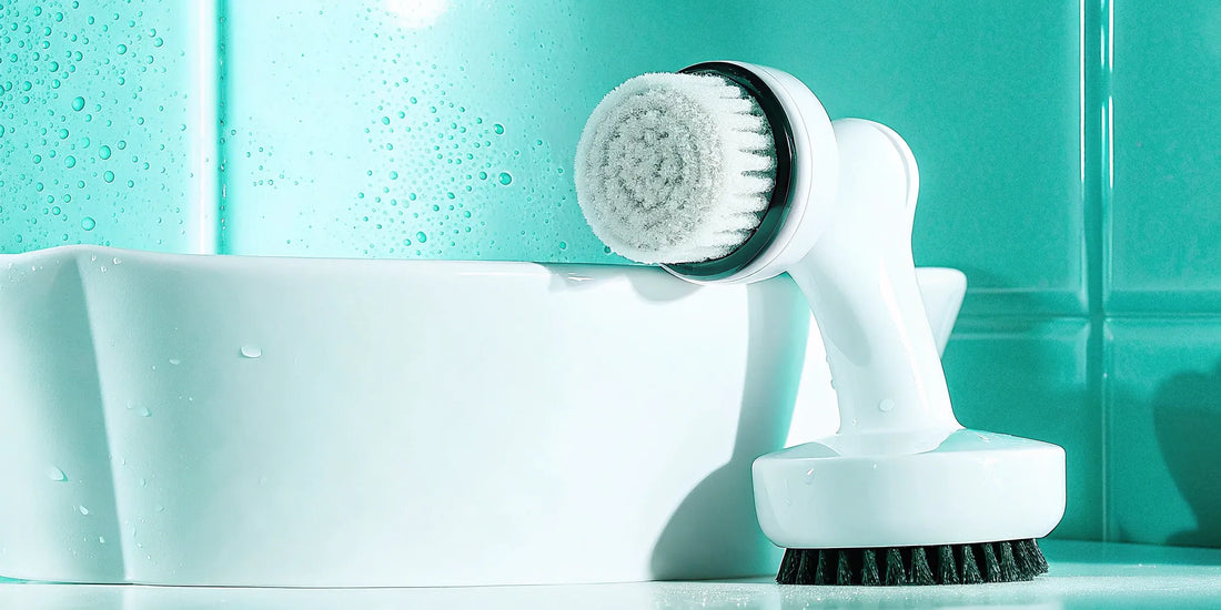 A facial cleansing brush with soft bristles, a key tool in a beginner's skincare routine.